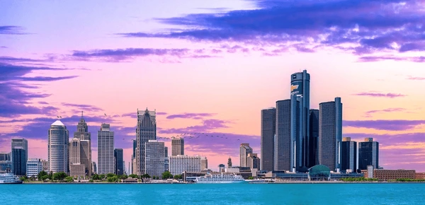 Sun setting Detroit Skyline from Detroit River
